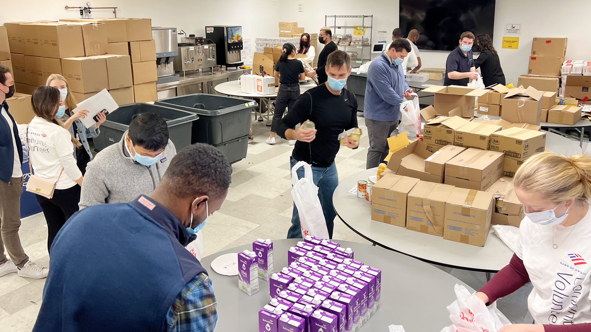 GMHC staff and volunteers packing food bags for clients